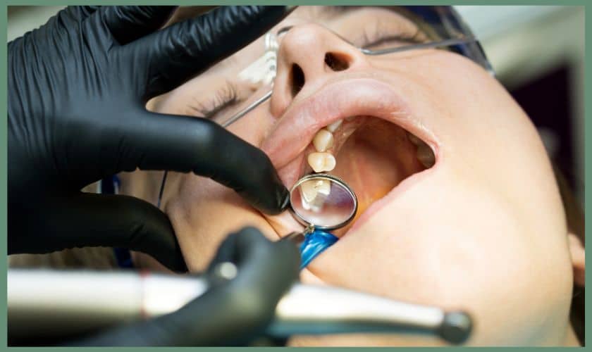 A patient getting examined before endodontic treatment by a dentist