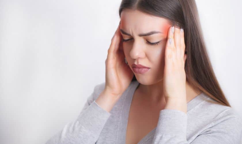 A lady suffering from migraine pain