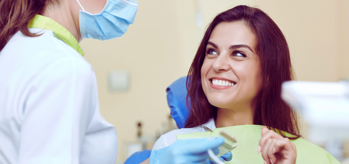 women smiling while having dental checkup
