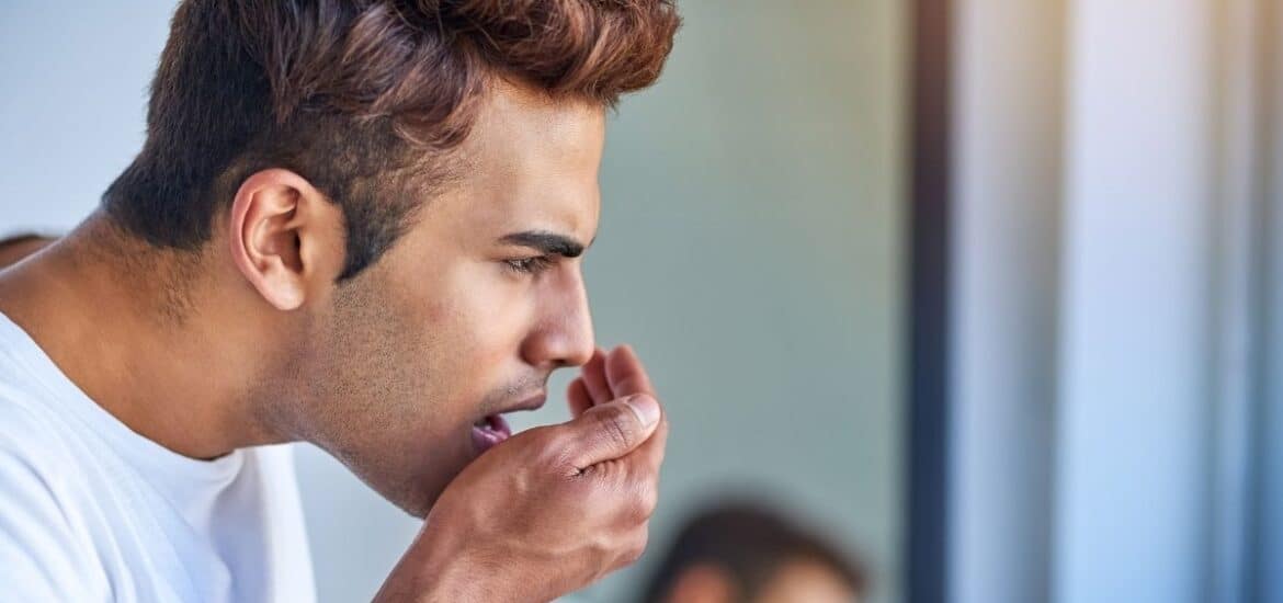 Man looks worried due to bad breath issues