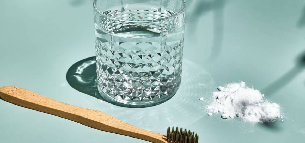 glass of water with salt for natural remedy of dental issue